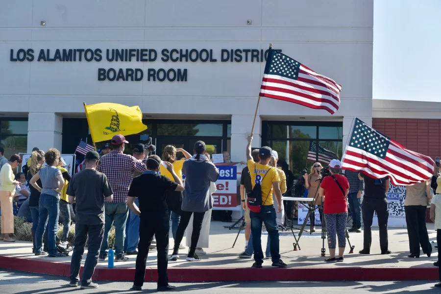 Protestors stand outside of the Los Alamitos district office demonstrating against the ethnic studies course and new social justice standards. Los Alamitos, California.