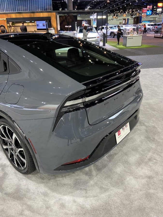 The rear-end of a gray Toyota Prius Prime.