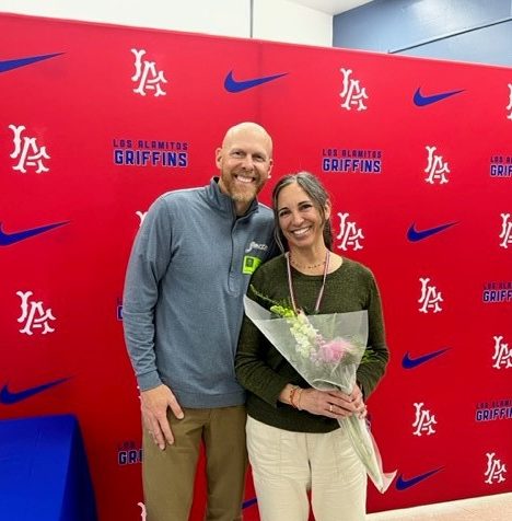 Mrs. Parsons receives a bouquet of flowers after being awarded 2023 Teacher of the Year. (Los Al Newsletter)