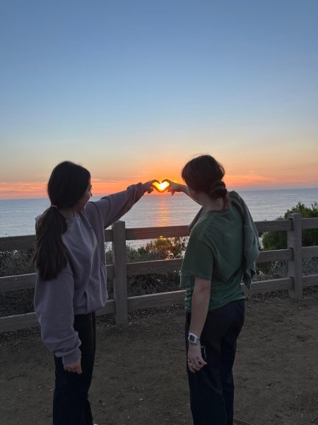 Marina Zeba and Issy Steinberg watching the sunset in Rancho Palos Verdes, California.