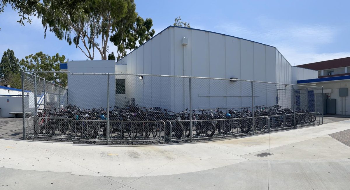 The bike rack of Los Al, located near the 150s building, is packed with e-bikes.