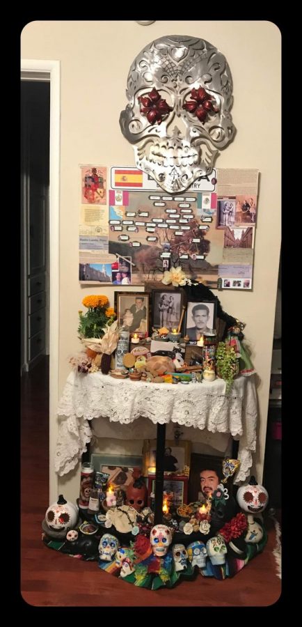 Decorating the ofrenda with my family for Dia de Los Muertos. (Photo Courtesy of Adalie Landa)