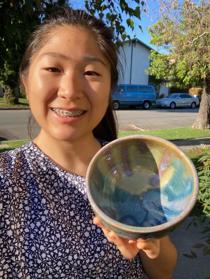 Cassia Park shares a photo of her and one of her pieces from ceramics.