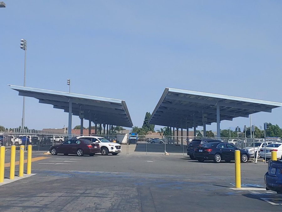 Construction of the solar panels takes up space in the back parking lot. 