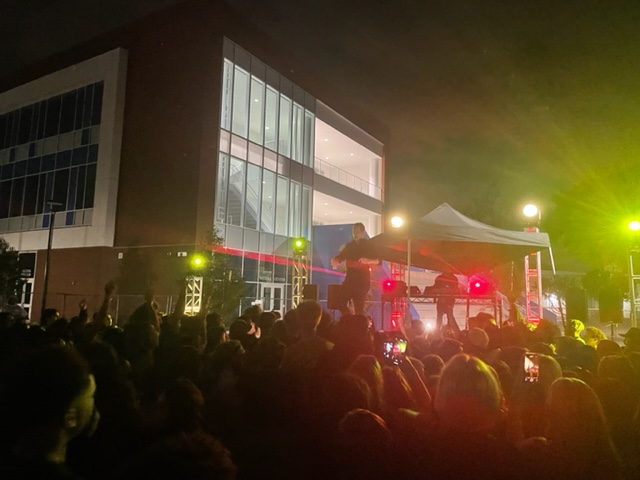 Students dance in front of the new STEM building during the dance.