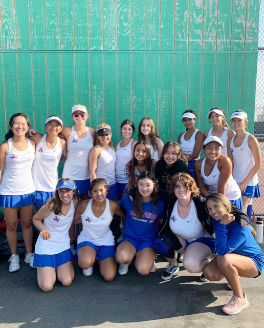 The Los Alamitos Girls Varsity Tennis Team posing for a quick group photo.