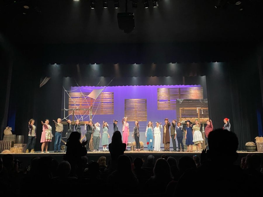 The cast of the show bowing and pointing to the crew