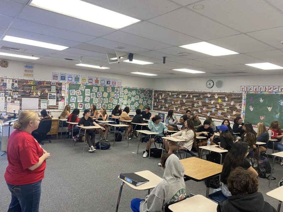 Los Alamitos high school students practice American Sign Language with their companions 