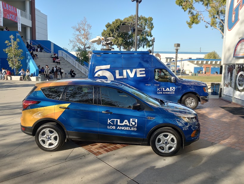 The two KTLA vehicles parked in front of the PAC before school starts. 
