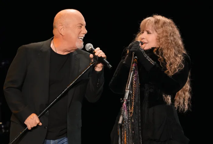 Billy Joel and Stevie Nicks singing Stop Draggin my Heart Around. 