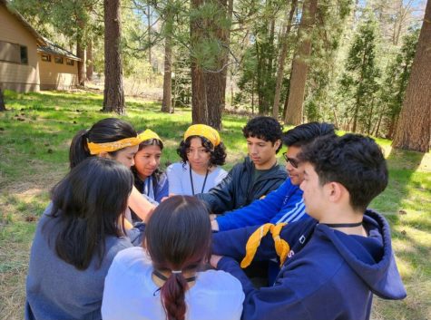Kim plays the “human knot” game with her team during the Rotary Youth Leadership Awards camp at Idyllwild Pines last month.