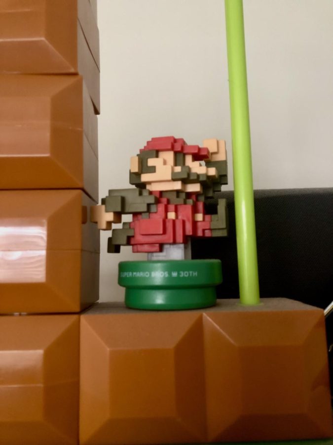 A pixelated Mario amiibo distributed for the 30th anniversary of the Super Mario Bros. franchise.