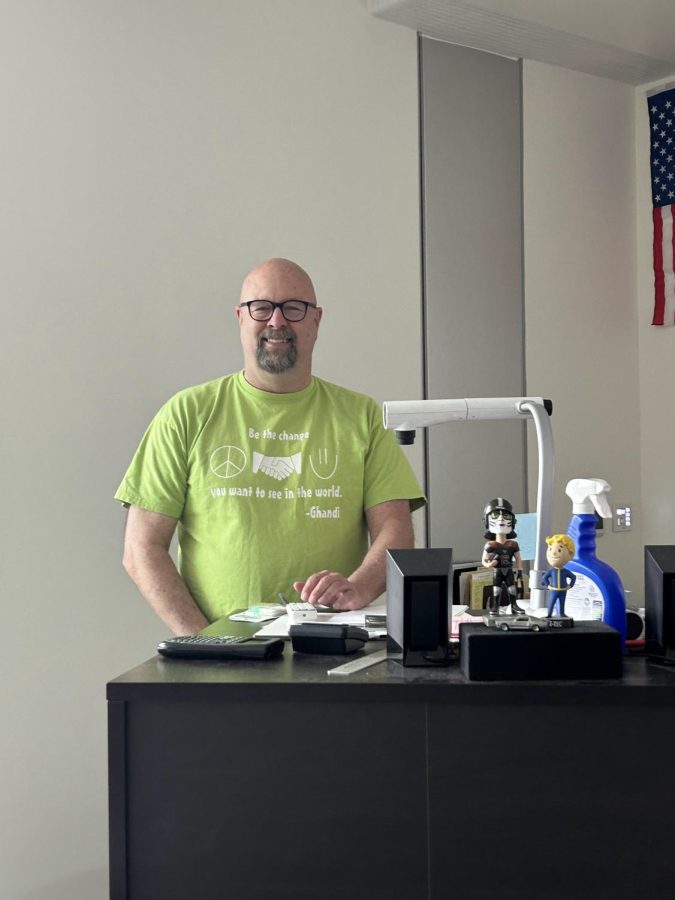 Mr. Ford, standing behind his podium in his classroom in the STEM building.