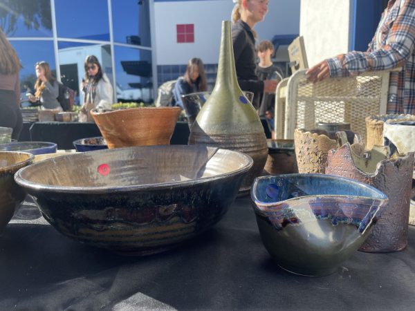 Intricate art made by the ceramic classes glows in the sun during the ceramics and jewelry sale.