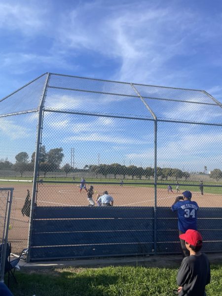 Los Als frosh softball team in the middle of playing their game.