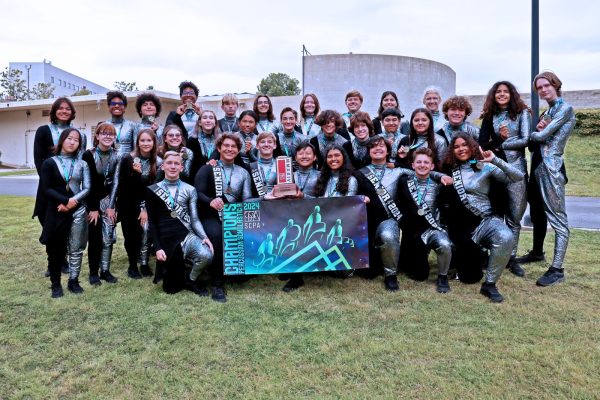 Students of Los Als drumline pose together for a team photo after winning gold.