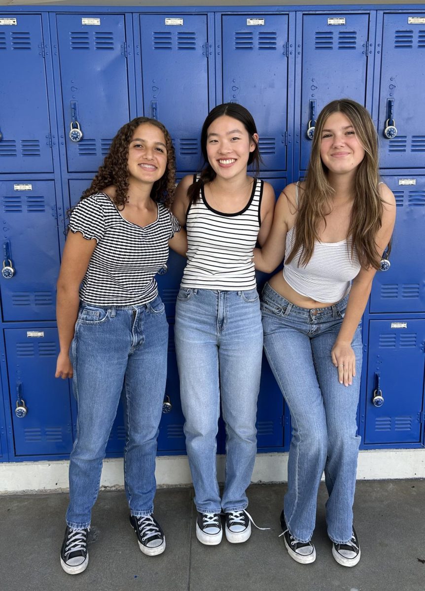 These journalism students matched in jeans and stripes for twin day.