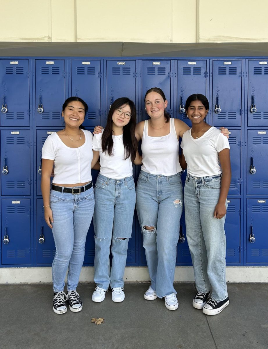  Four Griffin Gazette editors twinned with jeans, white tops and Converse.