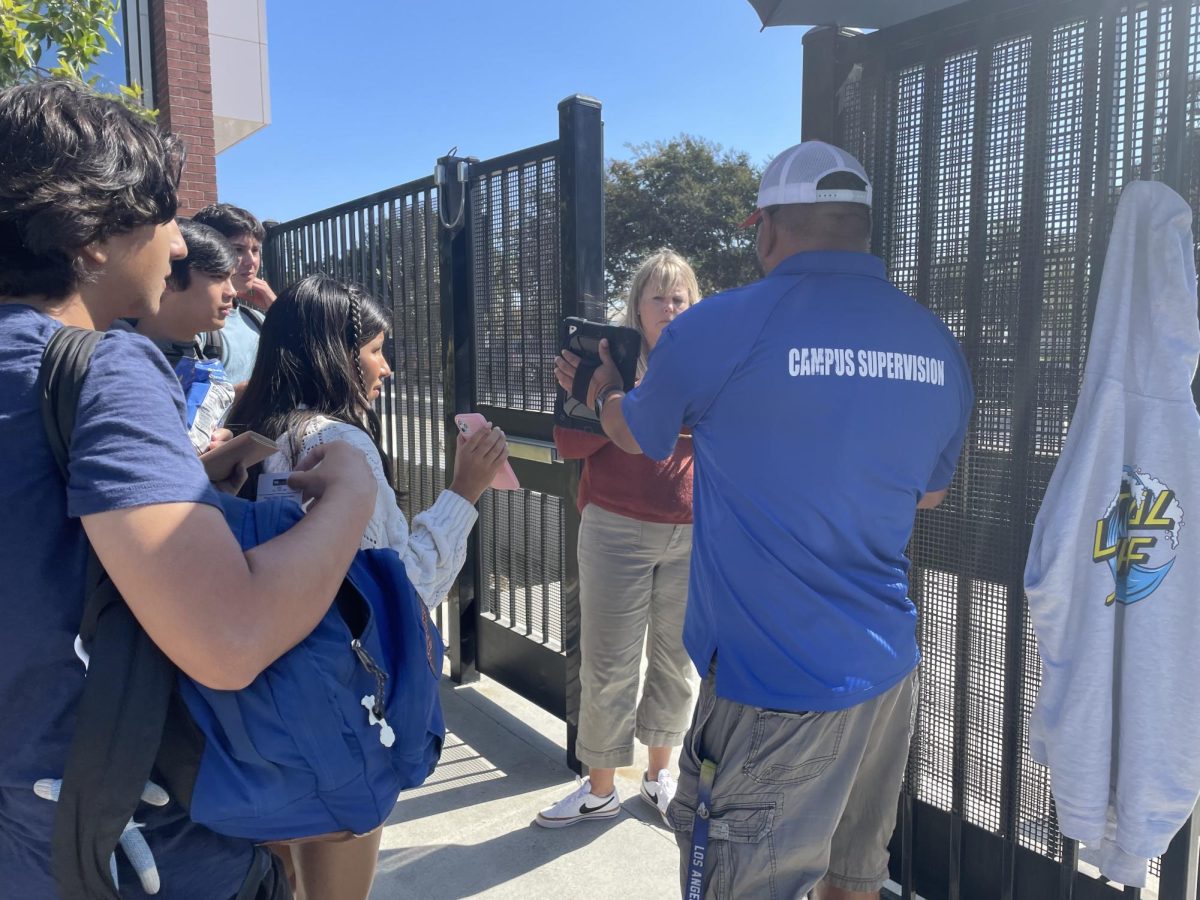 Students wait at the gates to leave for off-campus lunch. 