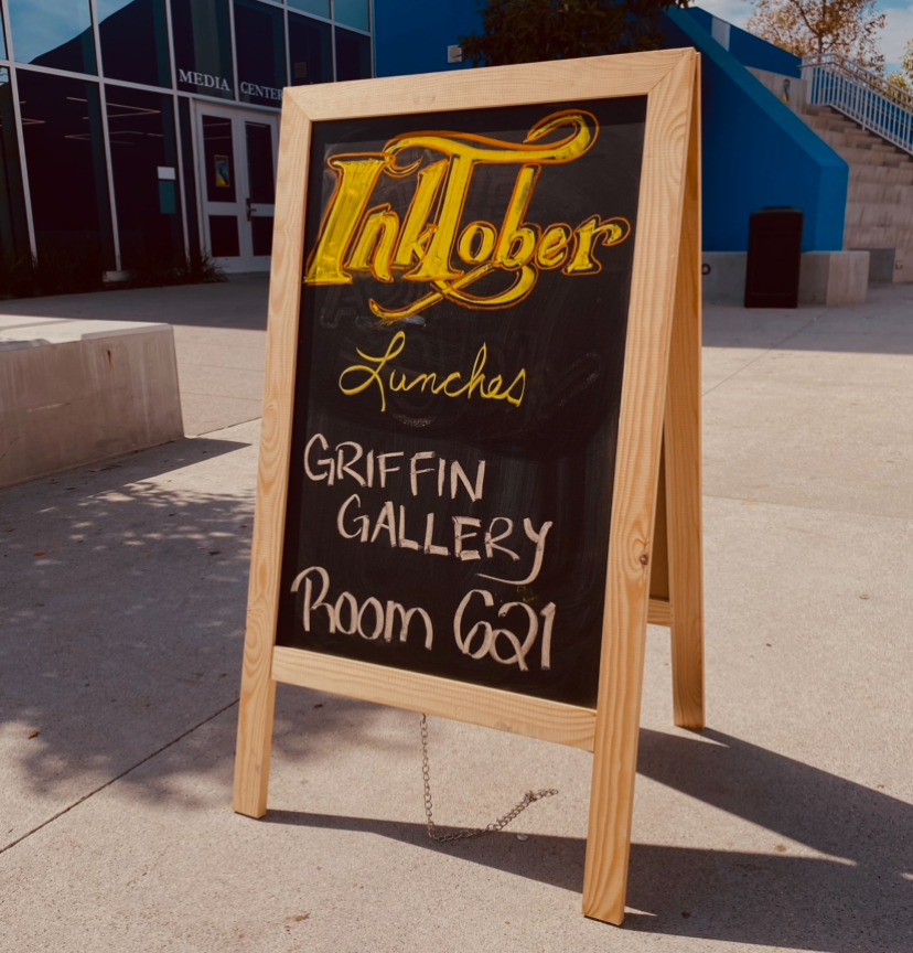 A sign advertising Inktober set around campus for student engagement. 