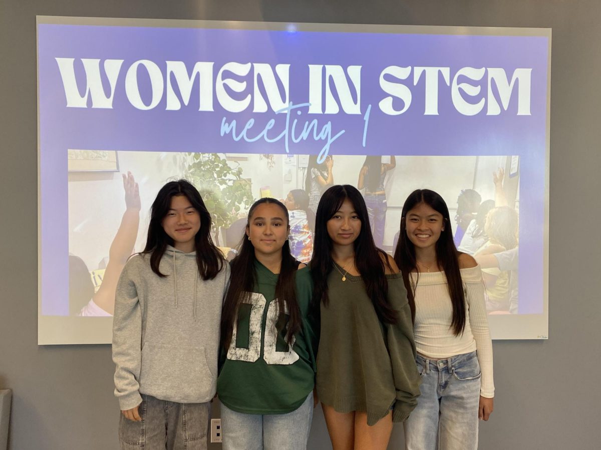 The Women in STEM board posing at a club meeting. (Photo courtesy of Dawn Mac)