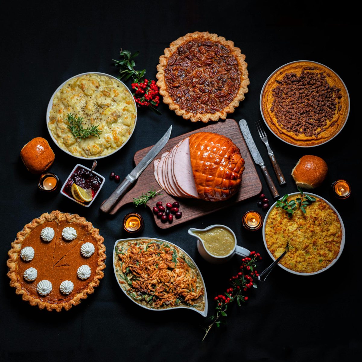 A typical Thanksgiving feast of pie, gravy, ham and other delicious dishes. (Photo courtesy of Unsplash)