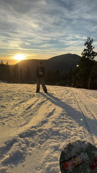 A student at LAHS teaches a fellow student how to snowboard.