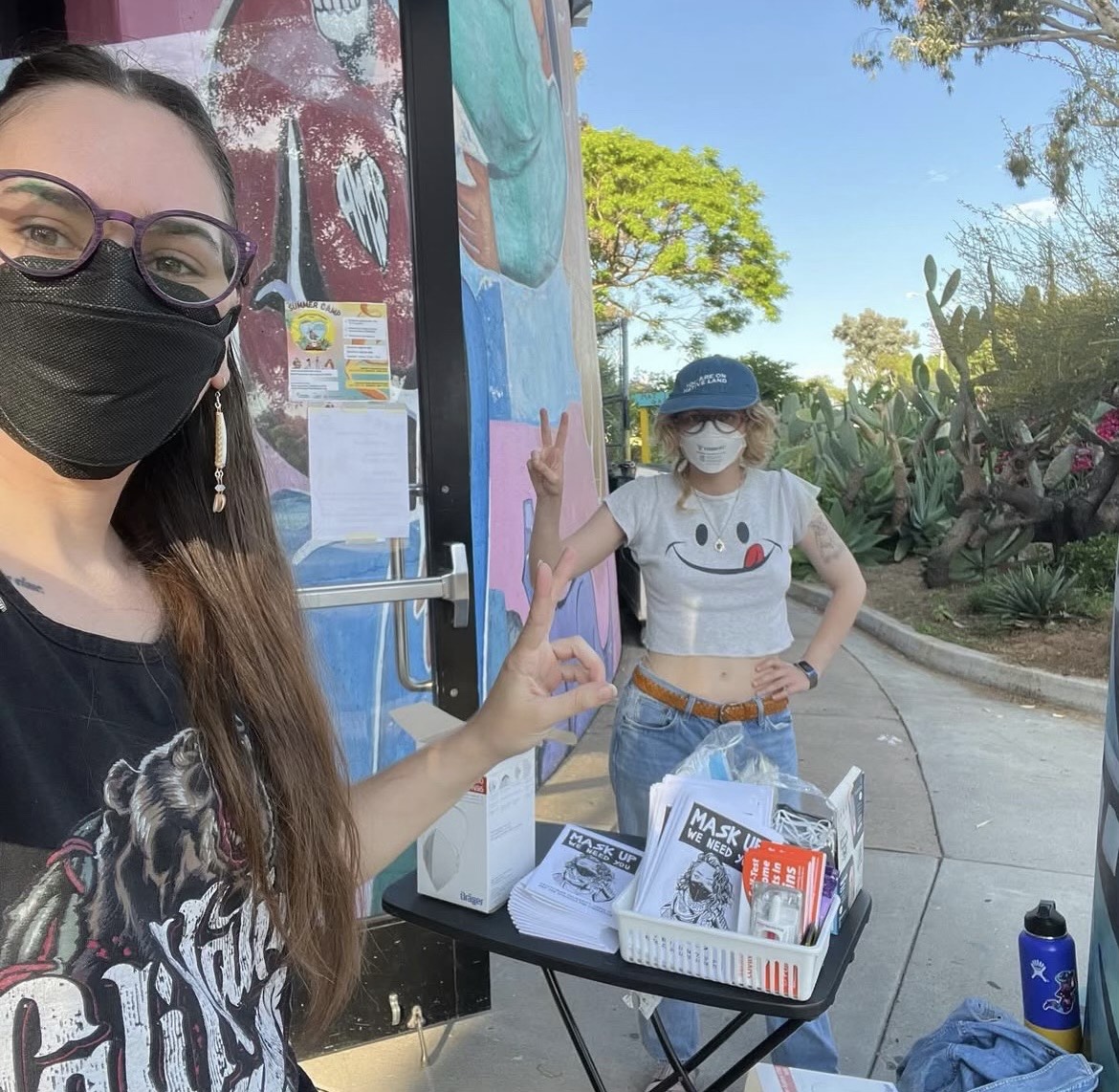 Siobhan (left) in action at a local community event. (Photo courtesy of San Diego Mask Bloc)