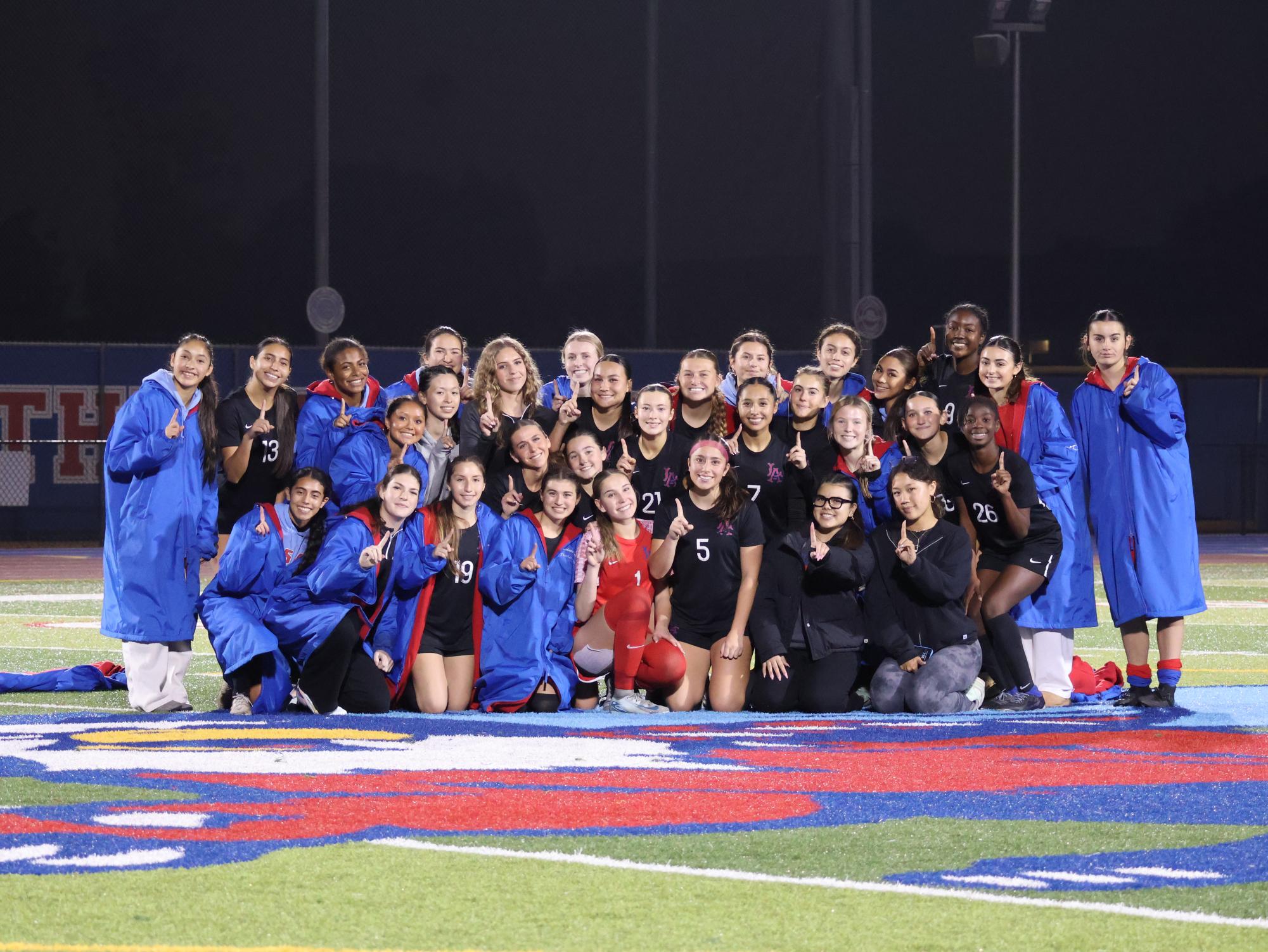 Following their victory against Newport Harbor, the team posed for a group photo. 