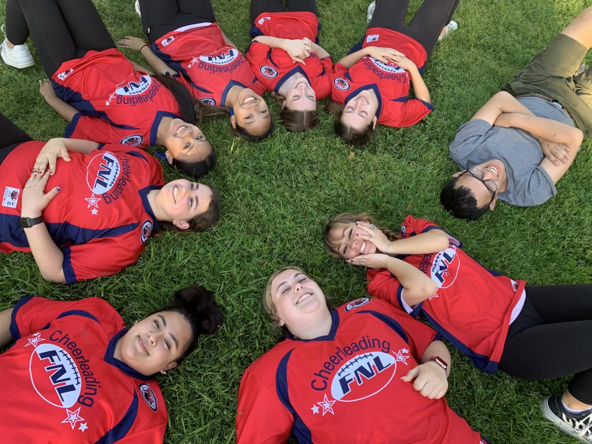 Cheer Coaches take part in their community by teaching young girls how to be spirited and confident (Photo courtesy of Los Alamitos FNL Cheer)