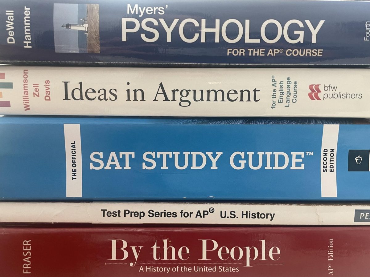 An SAT study guide along with other textbooks