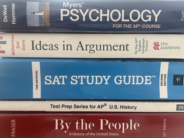 An SAT study guide along with other textbooks