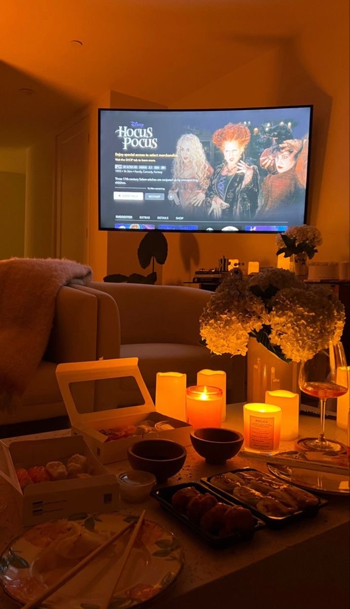 Hocus Pocus playing in the background, and fall decorations surrounded ready for a cozy movie night.