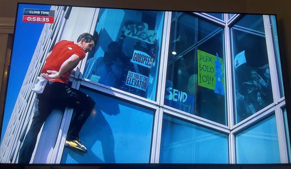 Honnold would continuously reach into a chalk pouch to improve his grip on the steel building while onlookers at various floors of the building cheered him on.