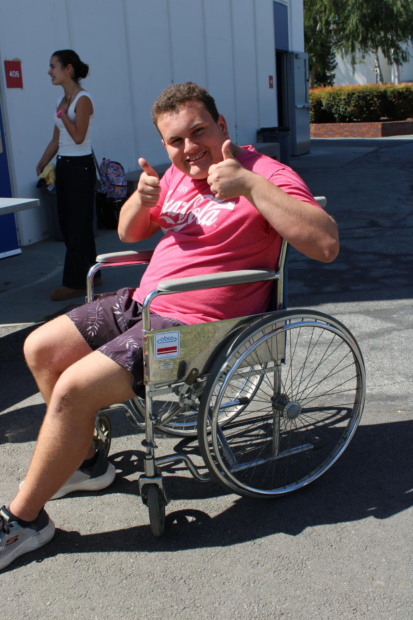 Students sat in wheelchairs and practiced maneuvering them through various obstacles.