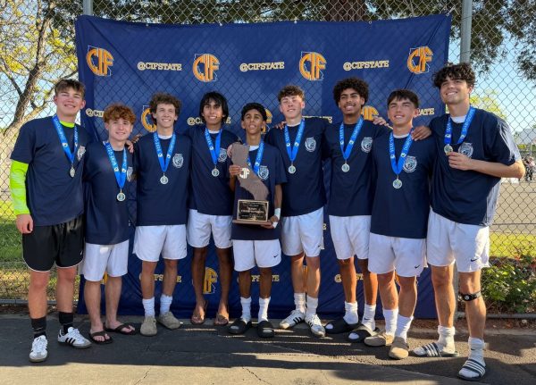 Seniors from the LAHS boys soccer team hold their CIF state championship trophy. (Photo courtesy of the LAHS boys soccer program)
