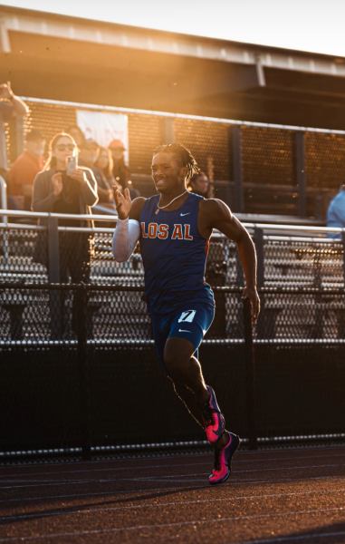 LAHS Varsity Track athlete, Kamden Tillis, running against Servite High School. (Photo courtesy of @sebasphotos03 via Instagram)