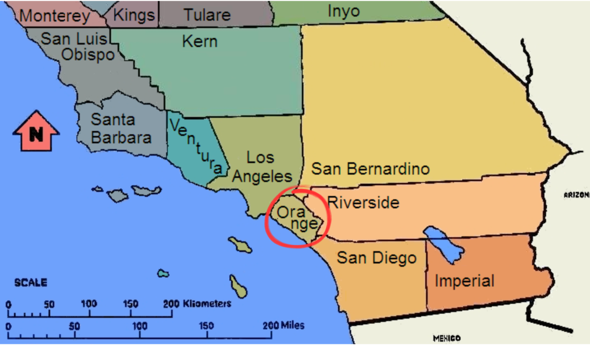 Los Alamitos High School teenagers Summer Sutter and Pearl Ronan emphasize the border of Orange County to the Brettling family, leaving them a map as a reference (Photo courtesy of Free Images)