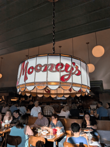 Mooney's Pizza, a new restaurant in Long Beach, pays homage to the idea of the classic with handmade glass lamps that hang over every booth.