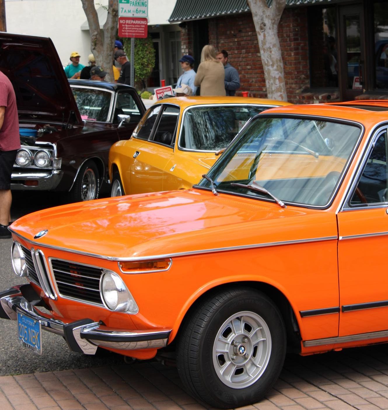 Pristine BMW 2002 in Inka Orange attracted many with its timeless styling reminiscent of the 1980s.