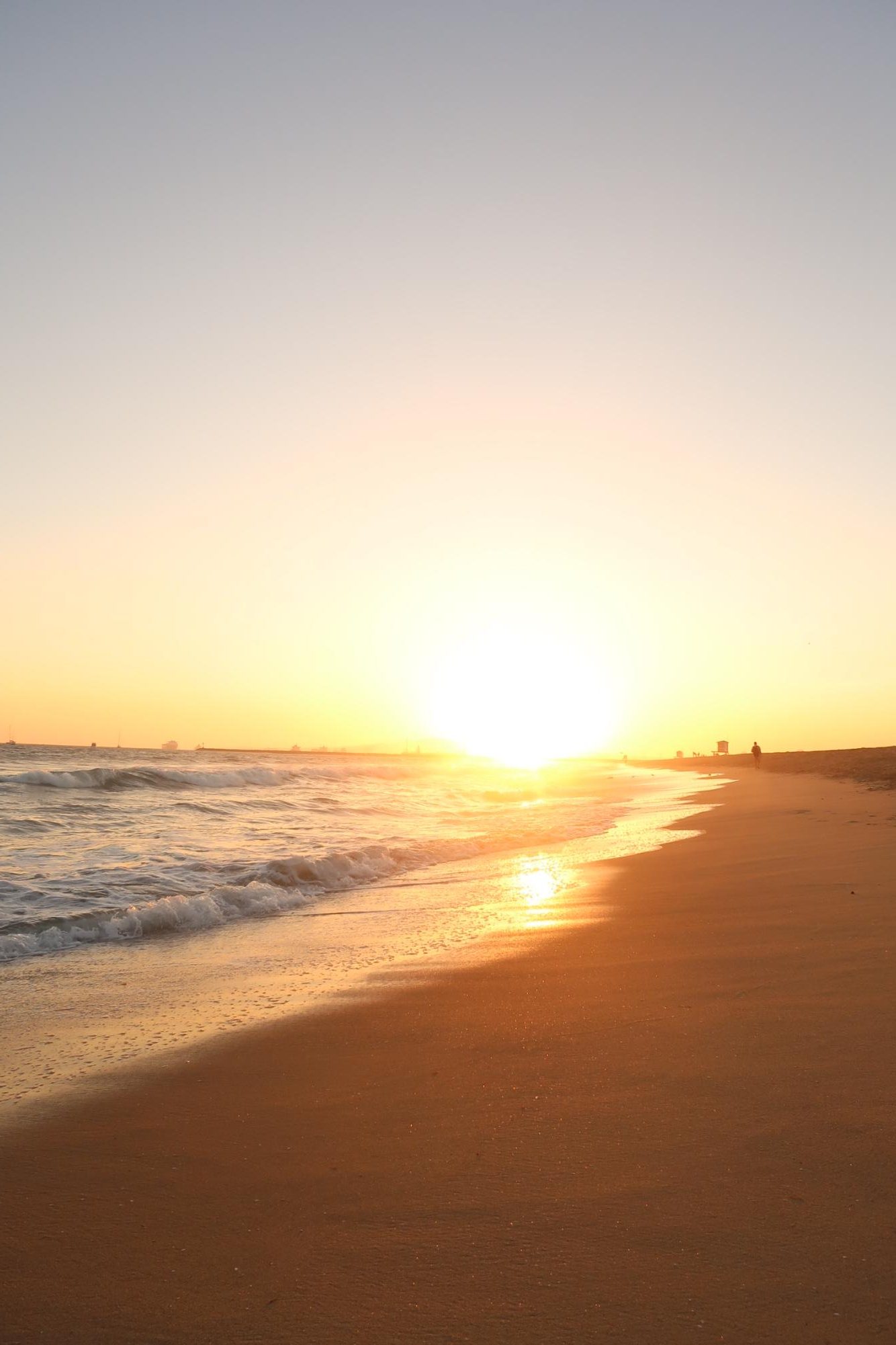 Sunset evening at Seal Beach down by the water and sand. 